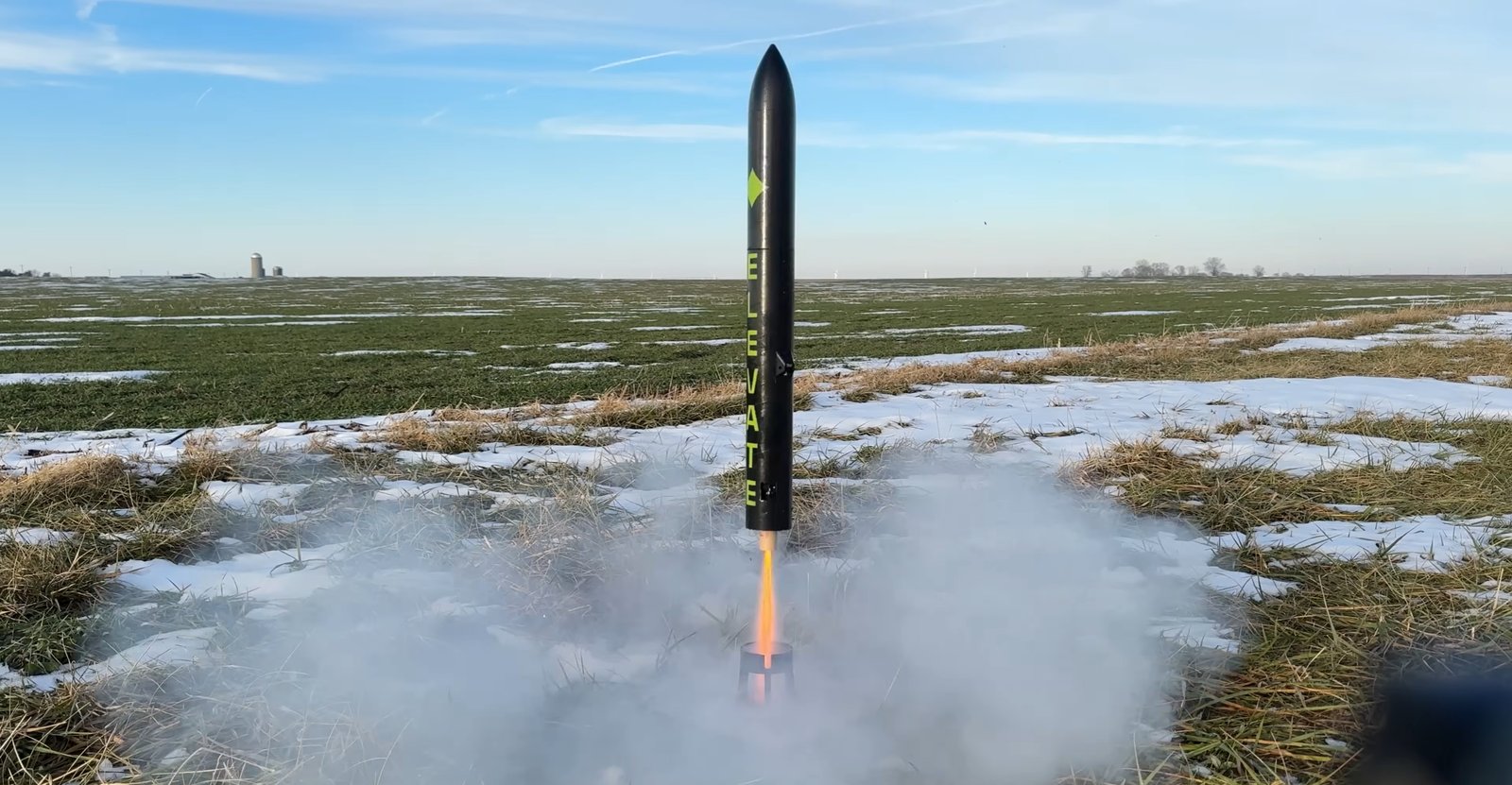 Elevate lifting off from a snowy field